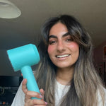 Happy customer with GlowCept High Speed Hair Dryer, showing smooth, shiny hair after fast drying and styling.