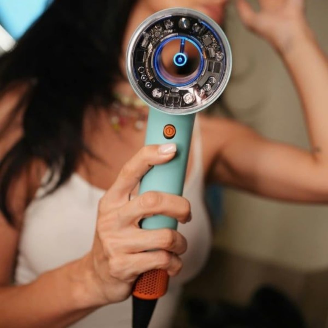 GlowCept High Speed Hair Dryer held in hand, showing advanced technology and modern design for fast, frizz-free styling.